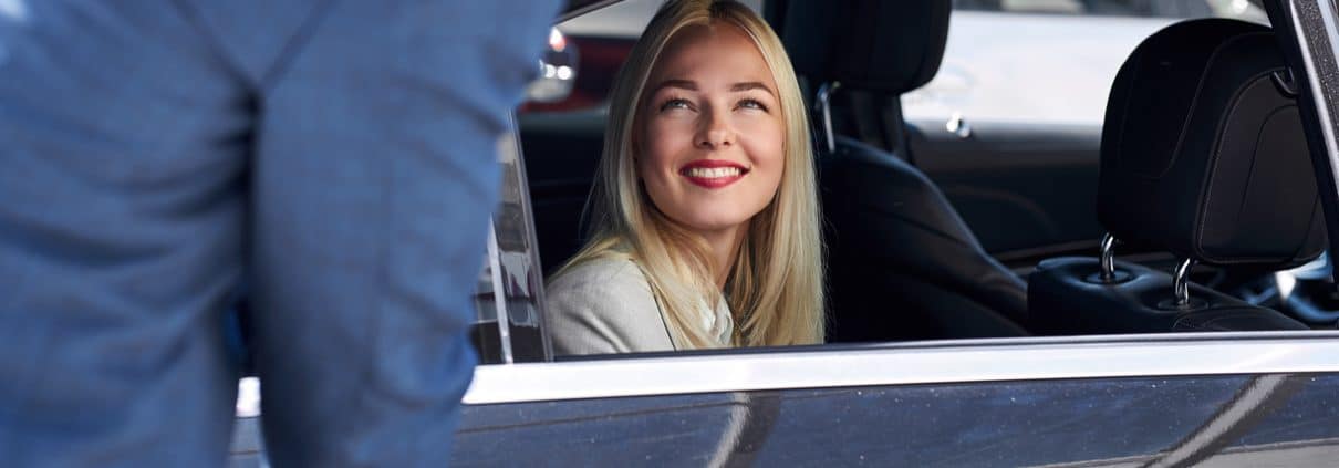 woman likes customer service in a private taxi